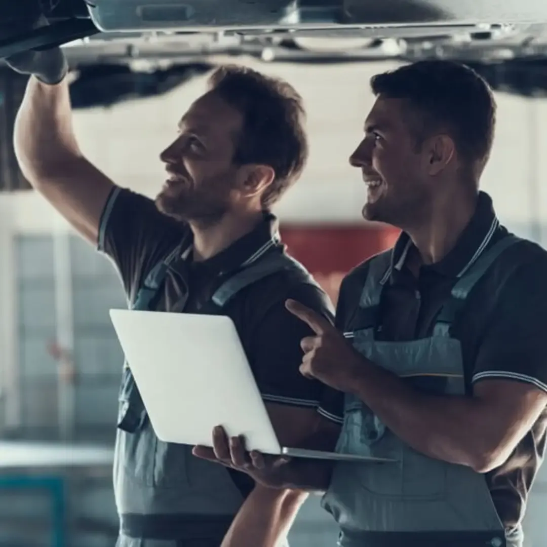 Inspecting a car during its inaugural MOT test in Cardiff.